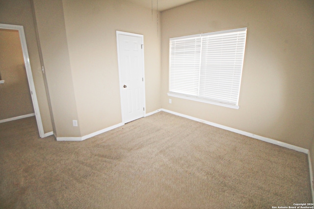 unfurnished bedroom with carpet