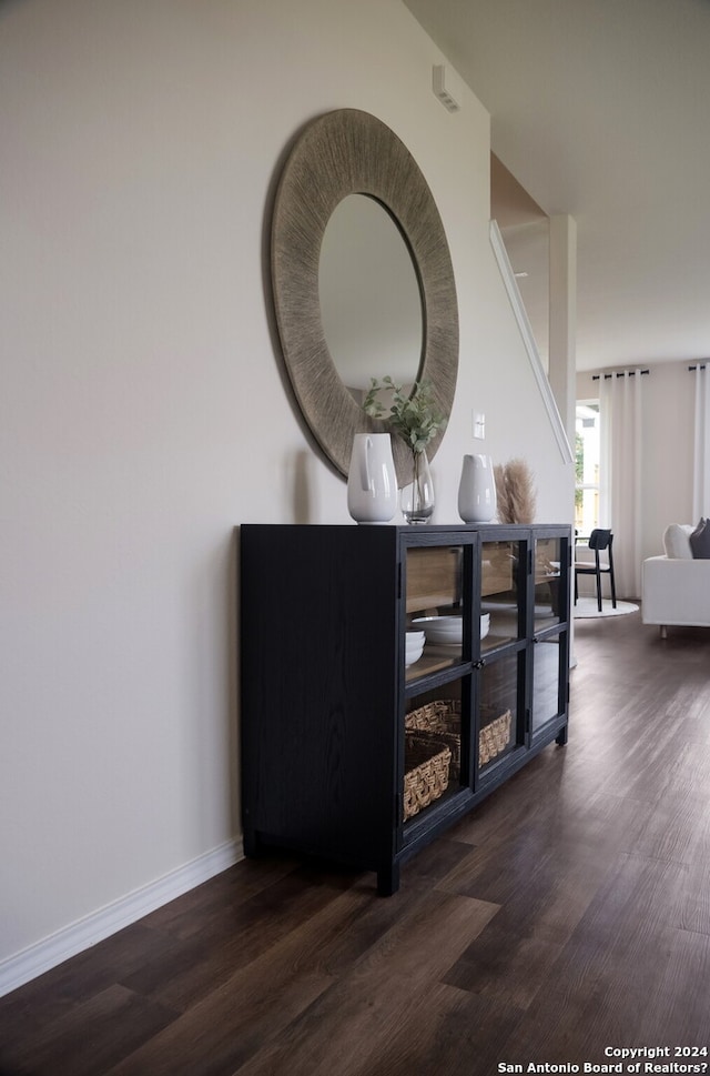 hall with dark hardwood / wood-style flooring