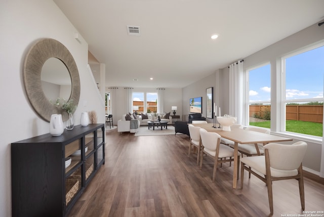 dining space with dark hardwood / wood-style floors