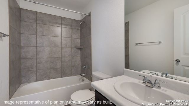 full bathroom featuring vanity, toilet, and tiled shower / bath