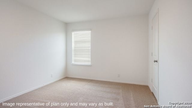 empty room with light colored carpet