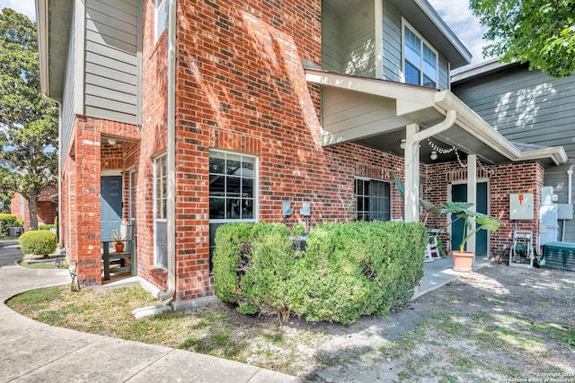 view of side of home featuring central AC unit