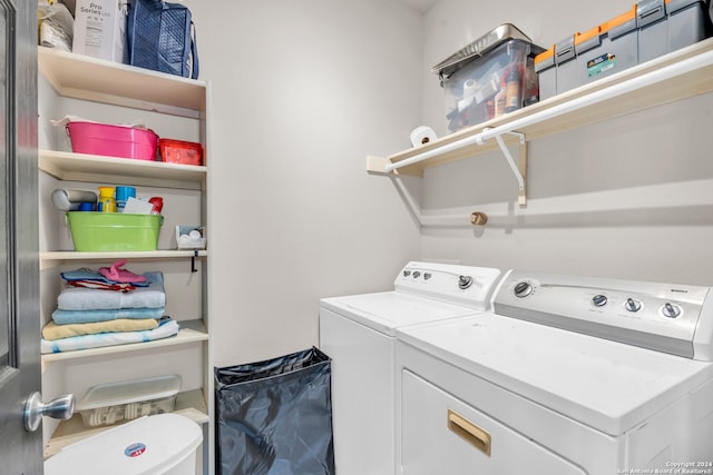 clothes washing area with washer and dryer