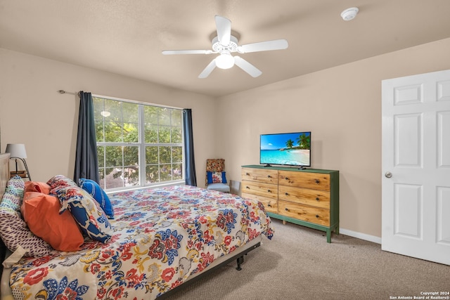 bedroom featuring ceiling fan and carpet flooring