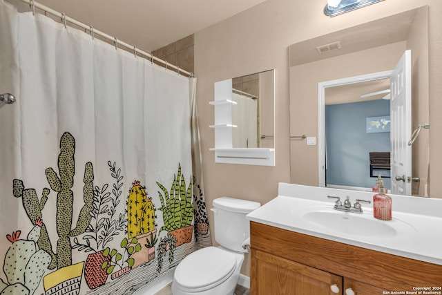 bathroom with vanity, toilet, and a shower with curtain