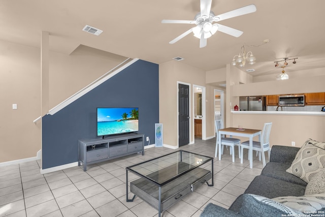 living room featuring ceiling fan and light tile patterned flooring