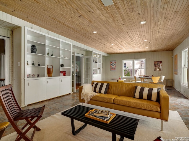 tiled living room featuring wood ceiling, built in shelves, and wood walls