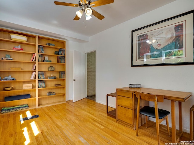 office featuring light wood-type flooring and ceiling fan