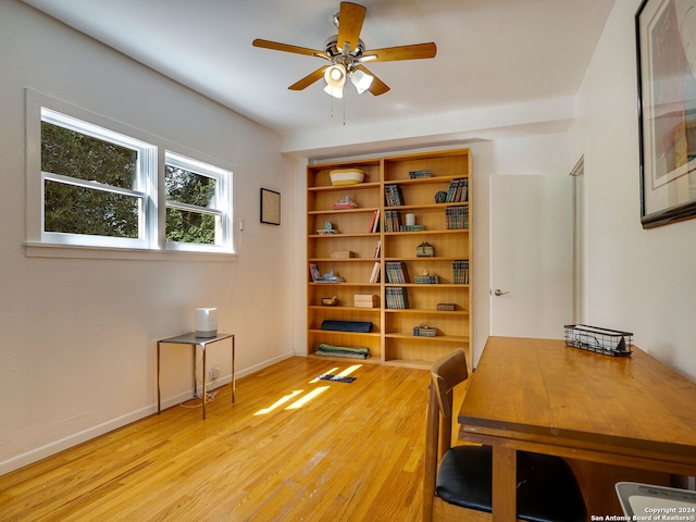 office with ceiling fan and light wood-type flooring