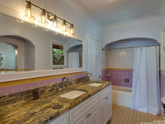 bathroom featuring backsplash, vanity, shower / bath combo, and tile patterned floors