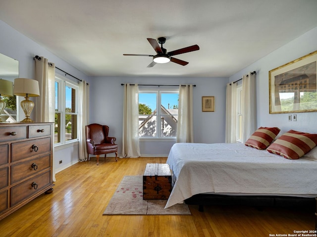 bedroom featuring light wood-type flooring and ceiling fan