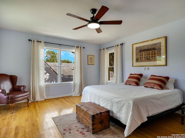 bedroom featuring light hardwood / wood-style flooring and ceiling fan