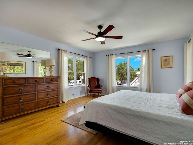 bedroom featuring light hardwood / wood-style floors and ceiling fan