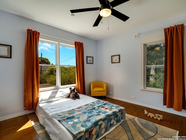 bedroom featuring dark hardwood / wood-style floors and ceiling fan