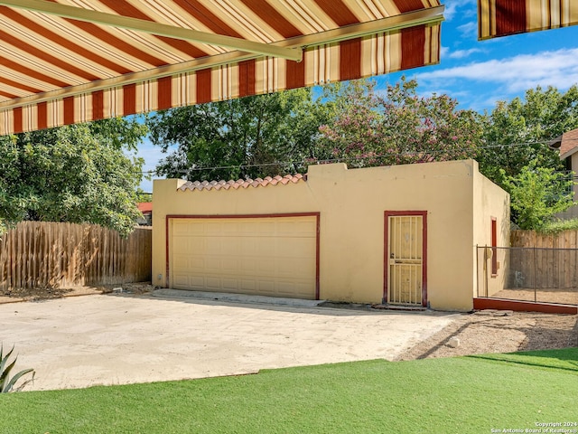 garage featuring a yard