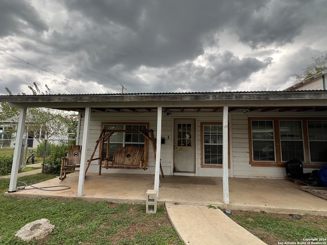 back of property featuring a patio area