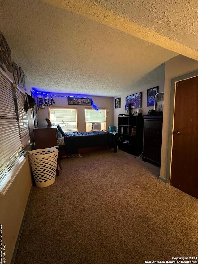 living room with a textured ceiling and carpet floors