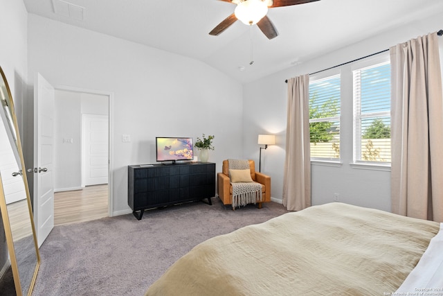 bedroom with light wood-type flooring, lofted ceiling, and ceiling fan