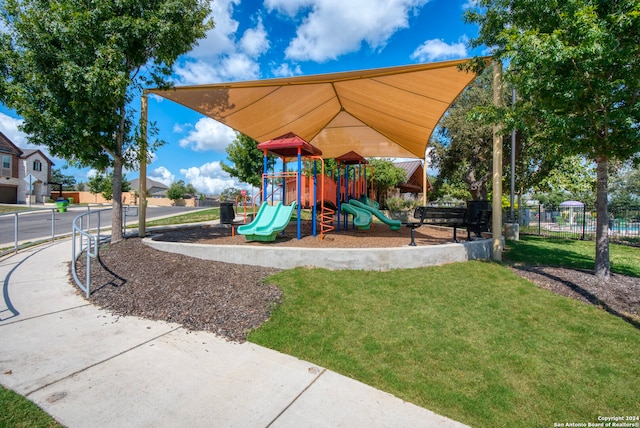 view of playground featuring a lawn