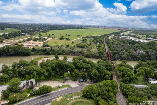 drone / aerial view with a rural view and a water view