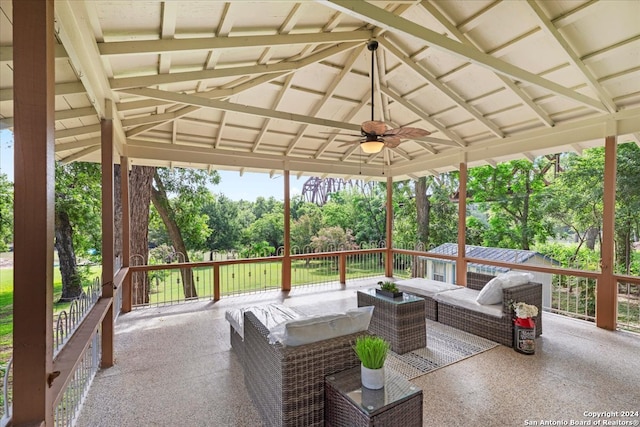 exterior space with ceiling fan and vaulted ceiling