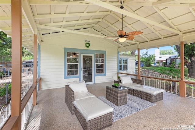 view of patio / terrace with ceiling fan and an outdoor living space