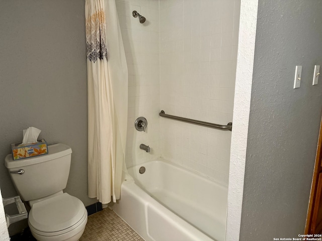 bathroom featuring toilet, tile patterned floors, and shower / bath combination with curtain