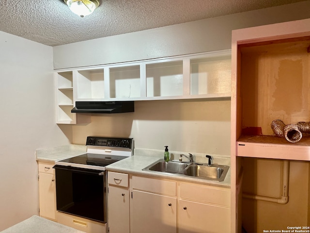 kitchen with a textured ceiling, sink, range hood, white cabinetry, and white electric range