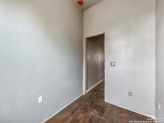 spare room with dark hardwood / wood-style floors