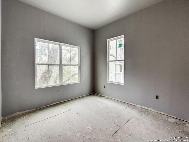 spare room with plenty of natural light