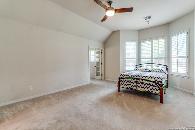 carpeted bedroom featuring ceiling fan and lofted ceiling