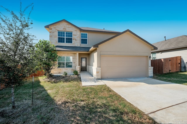 view of front facade featuring a front yard and a garage