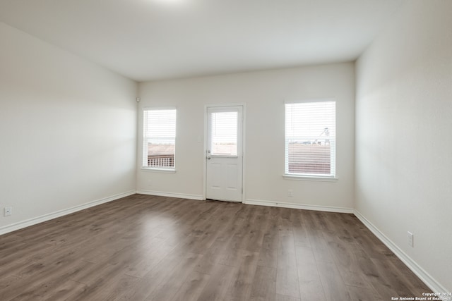 spare room with hardwood / wood-style floors