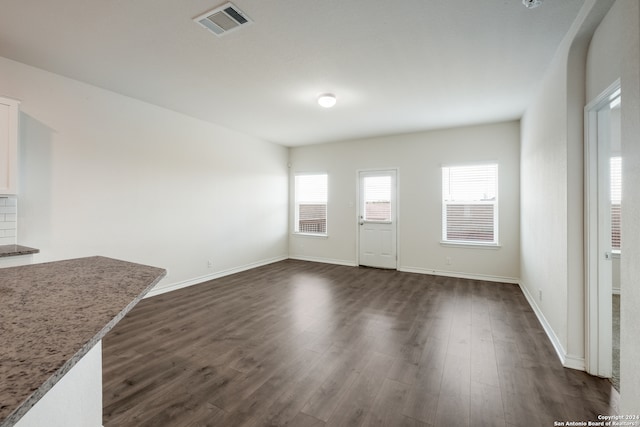 interior space with dark hardwood / wood-style floors