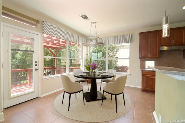 dining area with plenty of natural light and light tile patterned floors