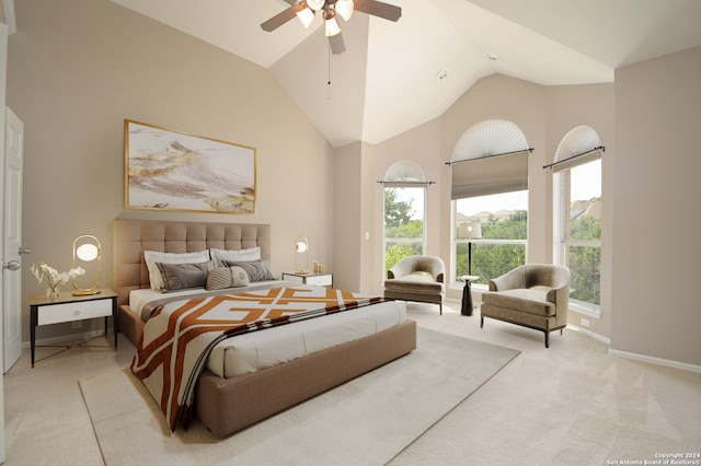 bedroom featuring ceiling fan, light colored carpet, and high vaulted ceiling