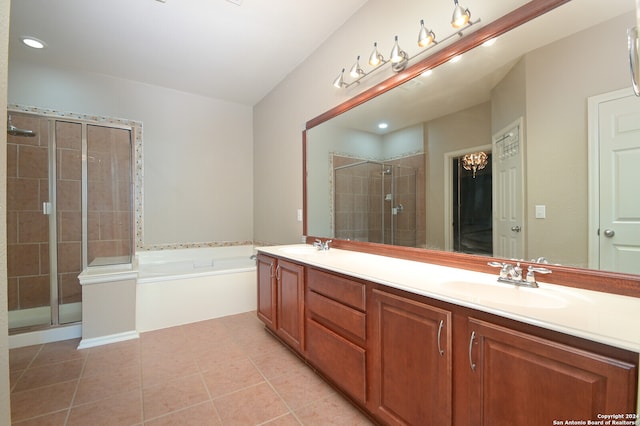 bathroom with plus walk in shower, tile patterned floors, and vanity