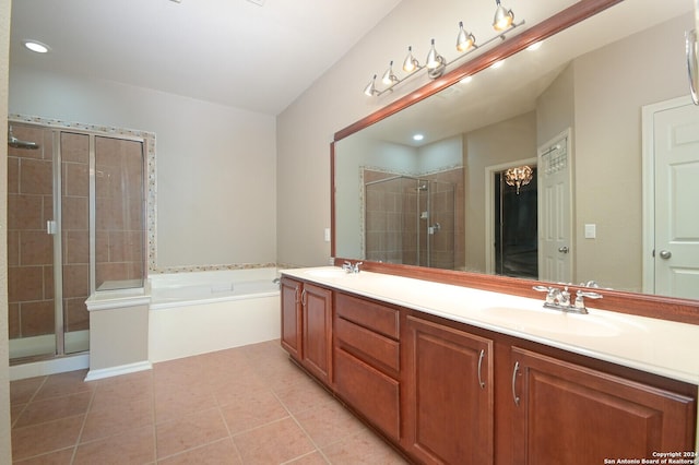 10606 Rainbow Vw, Helotes, TX 78023 - bathroom featuring a sink, double vanity, tile patterned floors, a bath, and a stall shower
