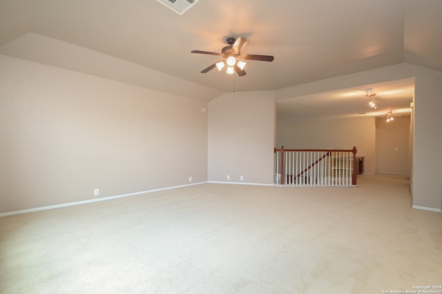 carpeted empty room featuring lofted ceiling and ceiling fan