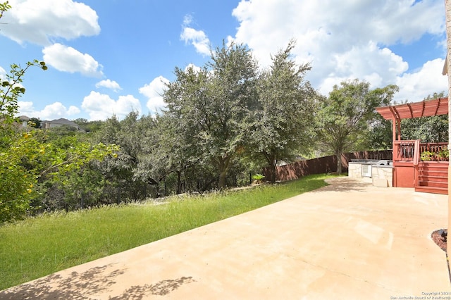 10606 Rainbow Vw, Helotes, TX 78023 - view of patio with an outdoor kitchen and fence