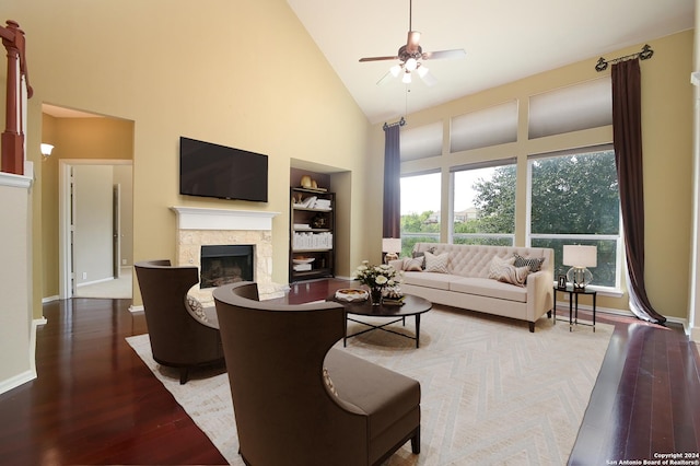 10606 Rainbow Vw, Helotes, TX 78023 - living room with built in features, wood finished floors, a fireplace, ceiling fan, and high vaulted ceiling