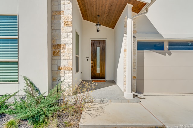 doorway to property with a garage