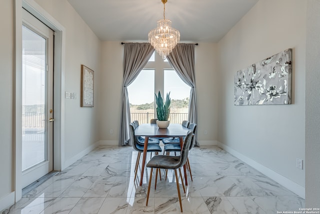 dining area with a notable chandelier