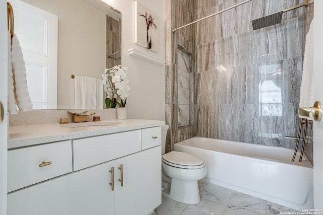 full bathroom featuring vanity, toilet, and tiled shower / bath