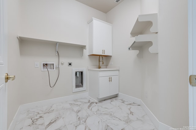 laundry room with cabinets, washer hookup, electric dryer hookup, sink, and hookup for a gas dryer