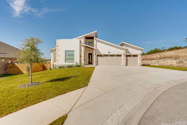 modern home with a garage and a front yard