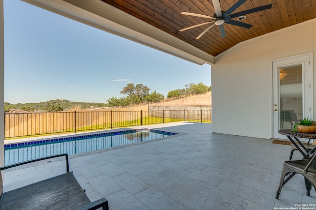 view of pool with a patio area and ceiling fan