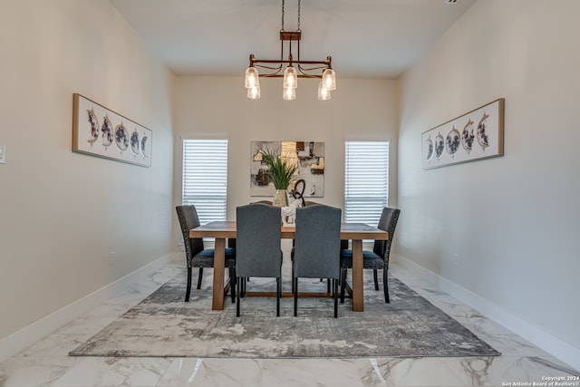 dining room featuring a chandelier