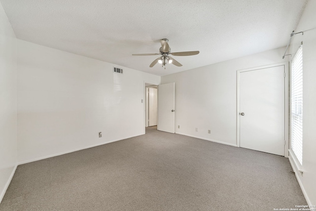 2300 Nacogdoches Rd Unit 232-I, San Antonio, TX 78209 - carpeted empty room with a textured ceiling, visible vents, a ceiling fan, and baseboards
