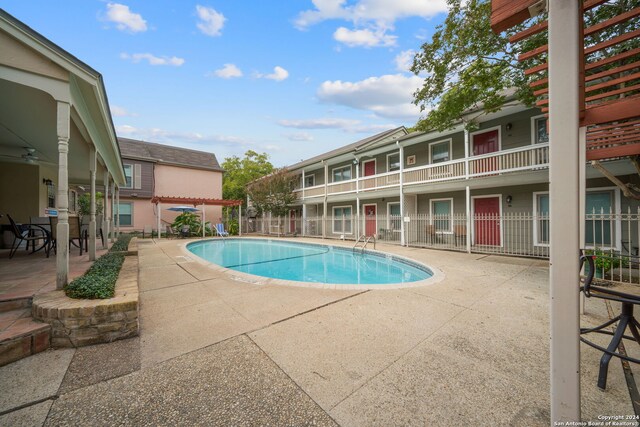 view of swimming pool featuring a patio area